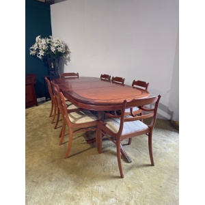 Mahogany Regency style twin pedestal dining table with eight matching chairs