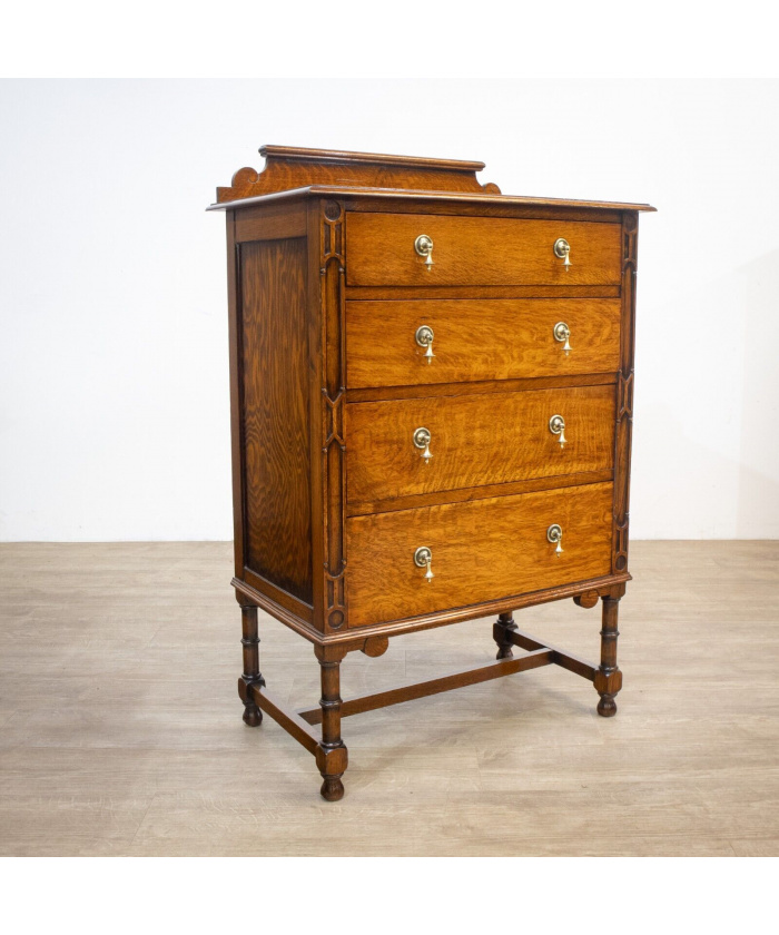 Narrow Oak Chest of Drawers with Art Deco Carving