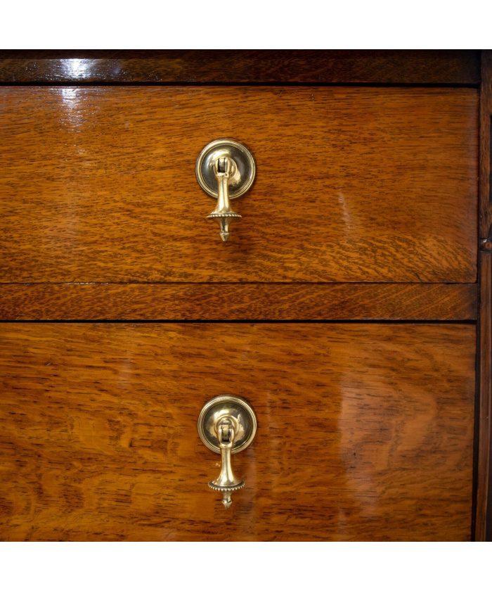 Narrow Oak Chest of Drawers with Art Deco Carving