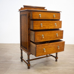 Narrow Oak Chest of Drawers with Art Deco Carving