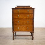Narrow Oak Chest of Drawers with Art Deco Carving