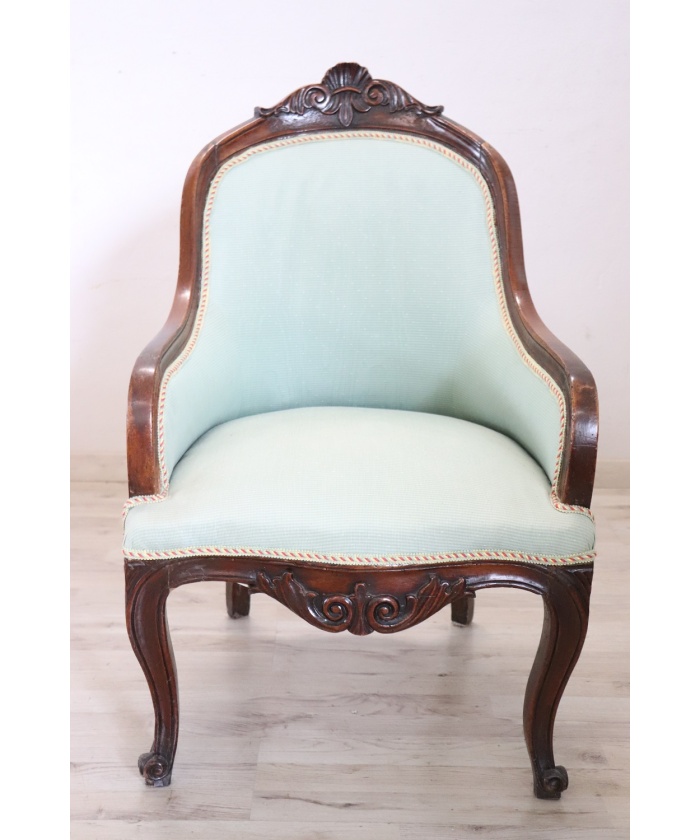 Antique upholstered walnut armchair